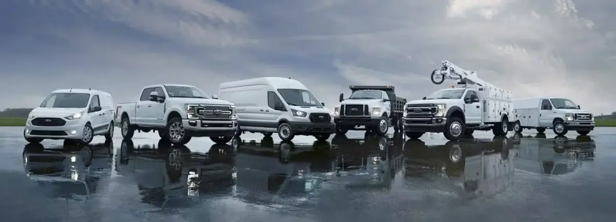 Ford commercial fleet lineup with a Transit Connect, Super Duty pickup, Transit high-roof van, and service body trucks