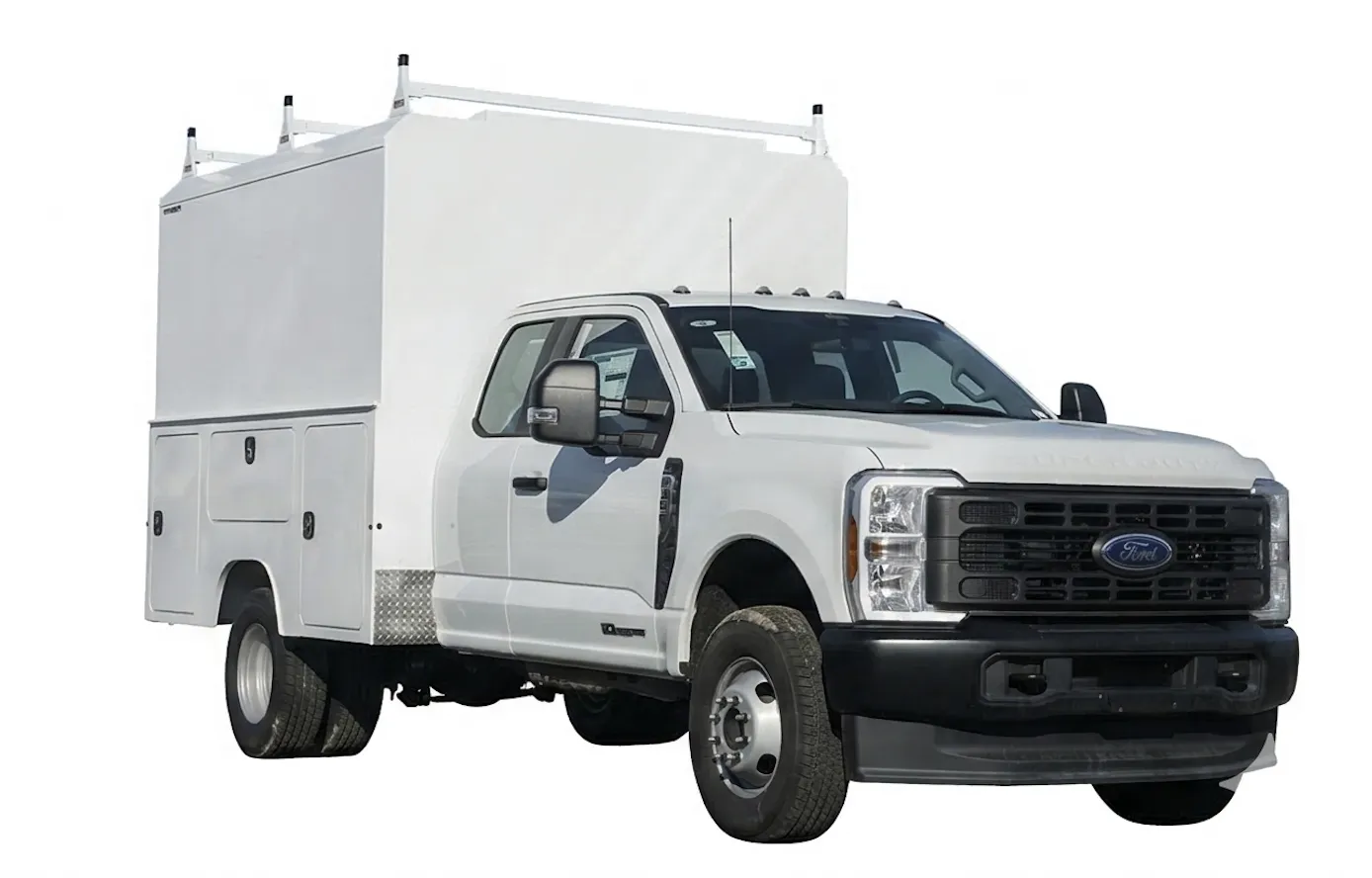 Ford Super Duty dually with an enclosed walk-in service body and full ladder rack